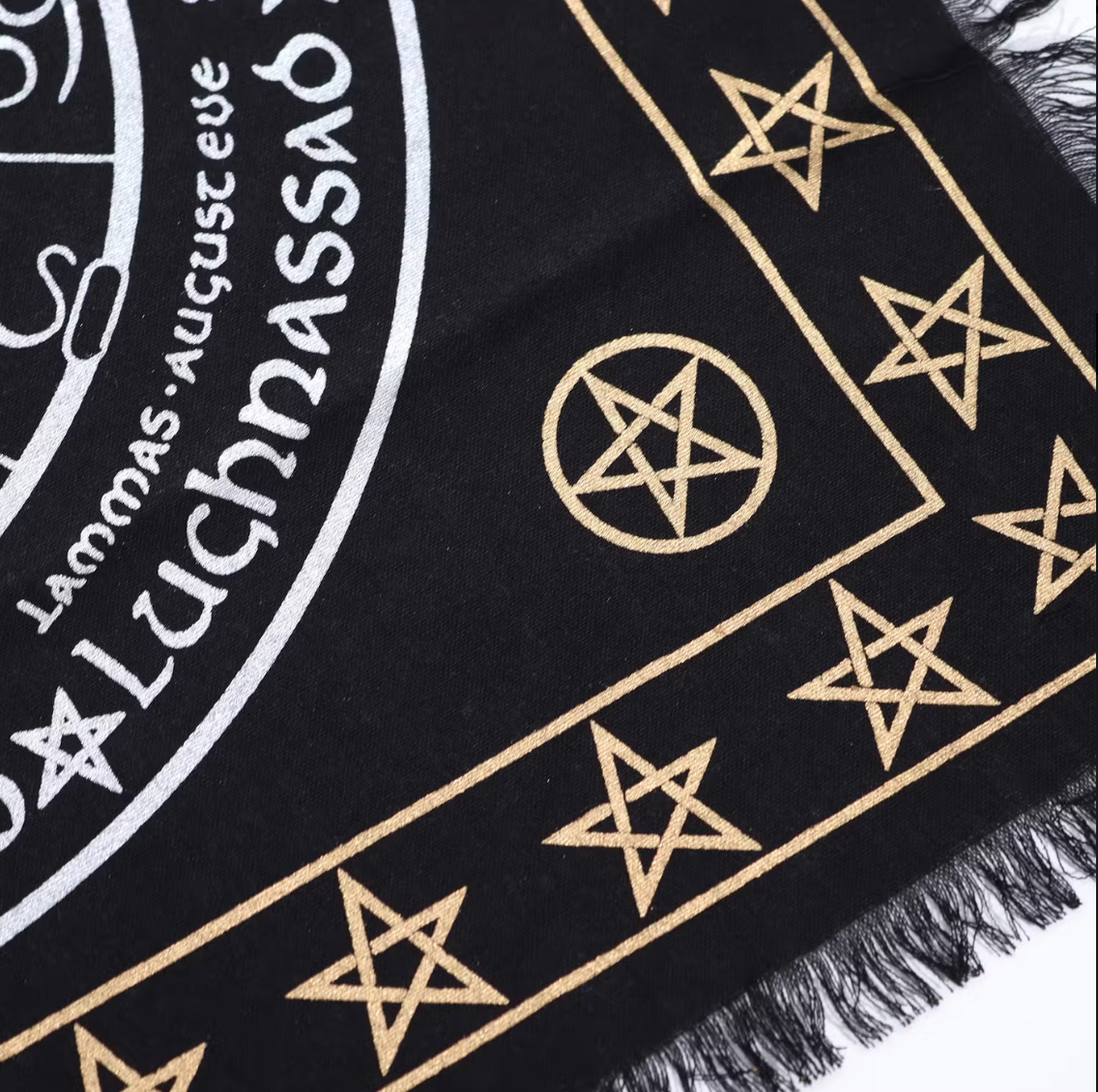 Black Altar cloth with gold star patterns and white text on a white background