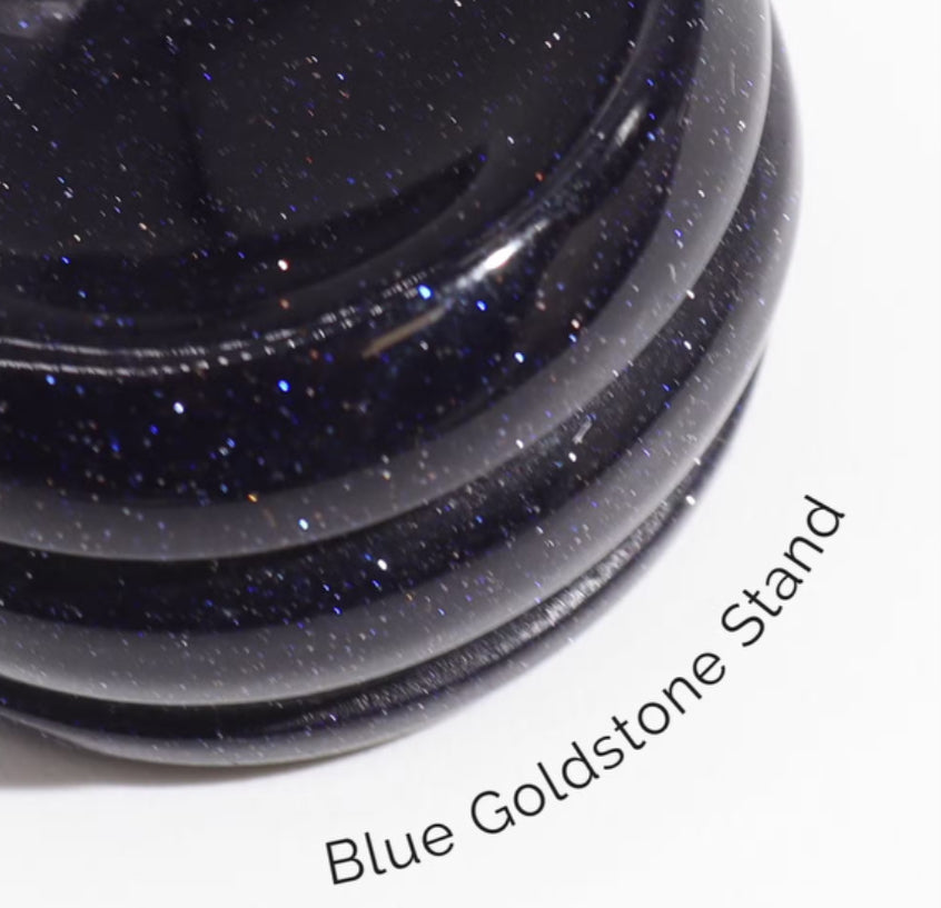 Stack of blue goldstone stands on a white background