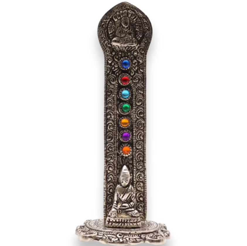 Decorative incense stick holder with seven colored beads and Buddha figures on a white background