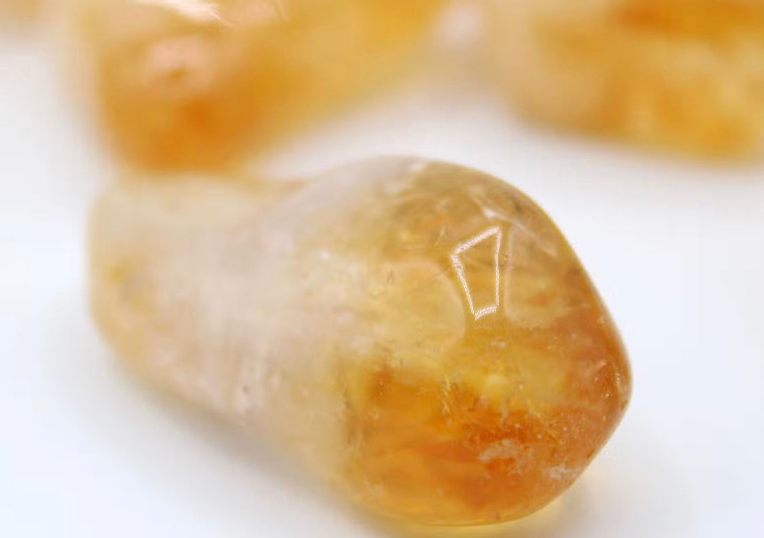 Large Citrine gemstones for Sacral Chakra balancing, authentic Brazilian crystals with natural variations in shape and golden hue.