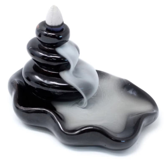Backflow incense burner with cascading pebble design flowing into a pool for calming smoke effect