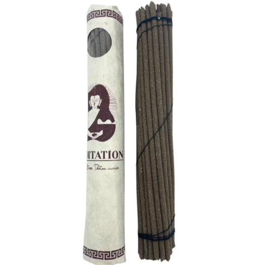 Hand-rolled Tibetan incense sticks for meditation, featuring a calming herbal blend in a traditional rolled paper pack of 30