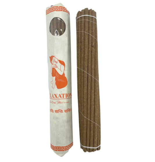 Hand-rolled Tibetan incense sticks for meditation, featuring a calming herbal blend in a traditional rolled paper pack of 30