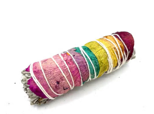 Colorful sage smudge stick on a white background