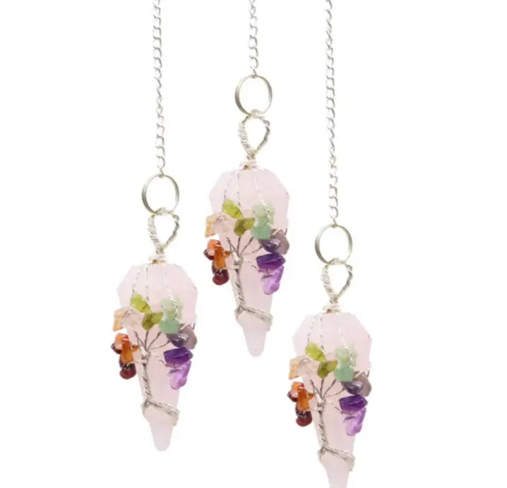 Crystal-themed earrings with colorful stones on a white background