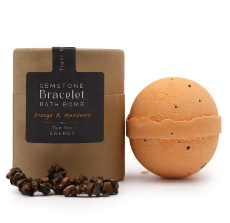 Bath bomb with packaging labeled 'Gemstone Bracelet Bath Bomb' on a white background